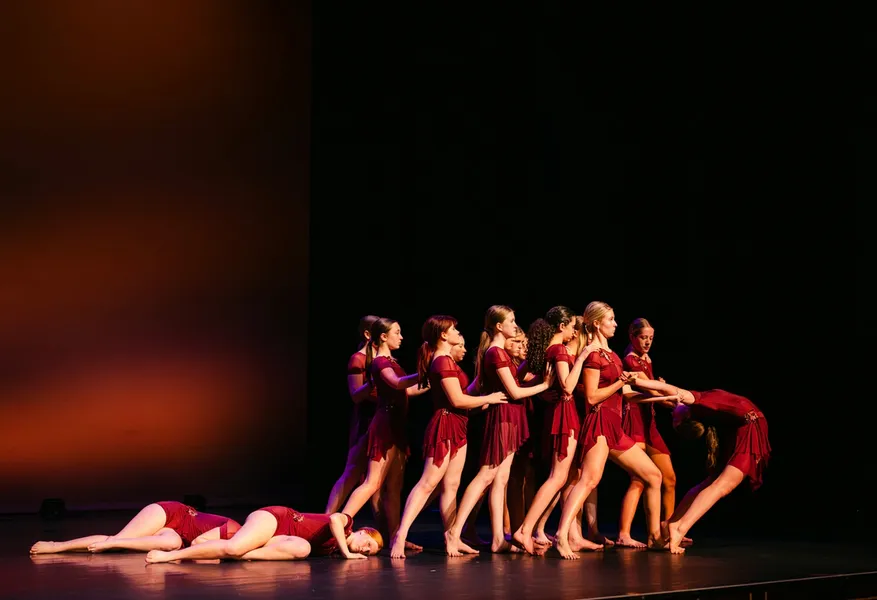 Dancers arranged like a pyramid